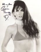 007 Bond girl Caroline Munro signed sexy 8x10 photo. Good condition. All autographs come with a