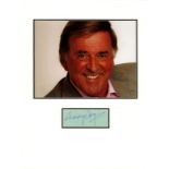 Terry Wogan signature piece mounted below colour photo. Approx size 16x12. 3 August 1938 - 31