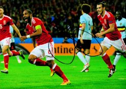 Football Ashley Williams signed 12x8 colour photo pictured celebrating while playing for Wales.