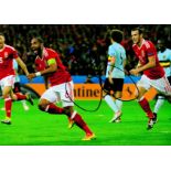 Football Ashley Williams signed 12x8 colour photo pictured celebrating while playing for Wales.