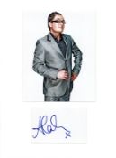 Alan Carr signature piece mounted below colour photo. Approx size 16x12. English comedian,