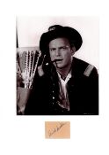 Ralph Meeker signature piece mounted below b/w photo. Approx overall size 14x11. Good condition. All