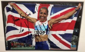 Dame Kelly Holmes Hand signed 12x8 Colour Photo of Holmes after winning two Gold Medals in Athens in