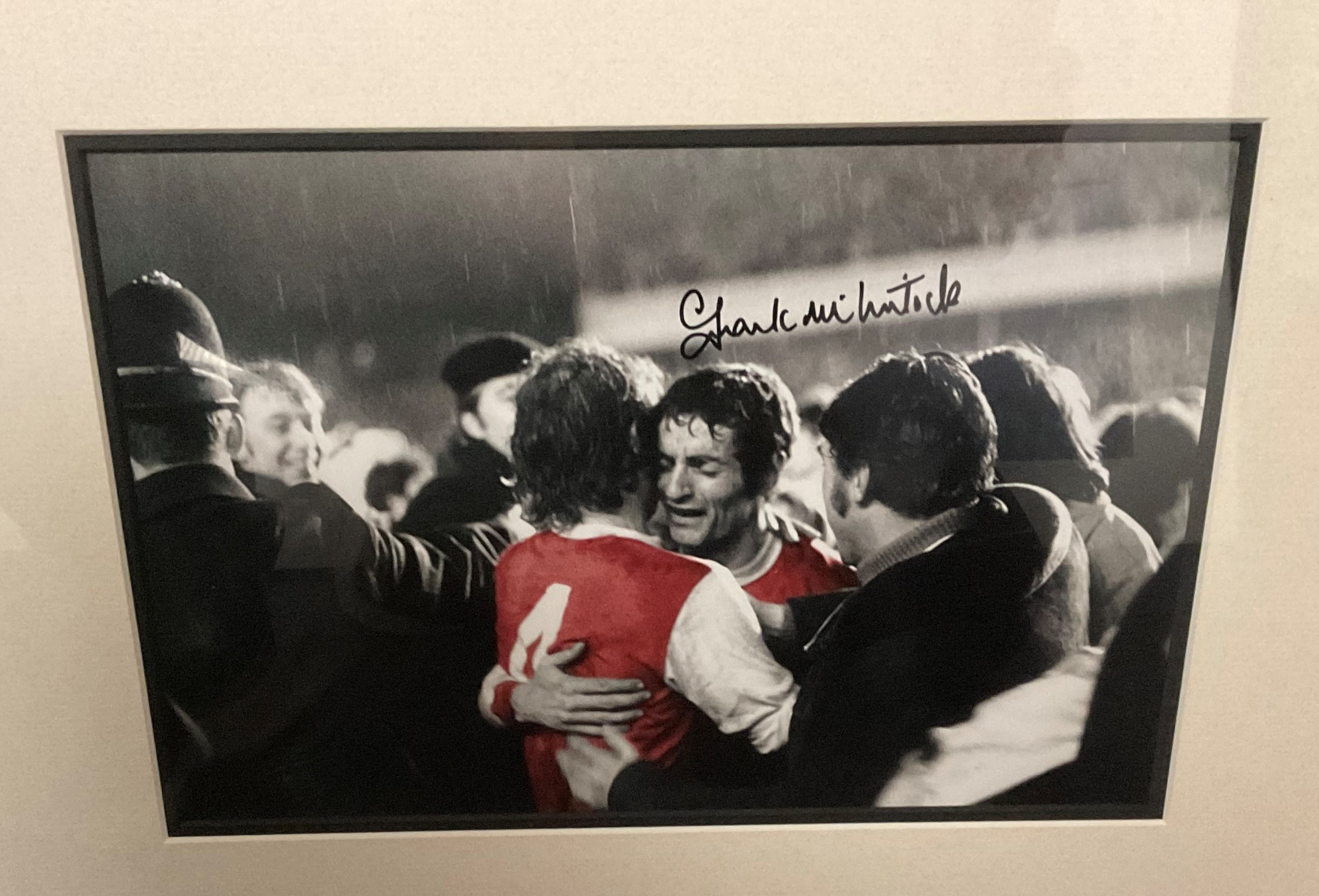 Arsenal Legend Frank McLintock MBE Hand signed 12x8 Colourised Photo in Frame measuring 20. 5x17.