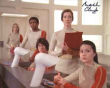 Space 1999 scene photo signed by actress Melita Clarke. Good condition. All autographs come with a