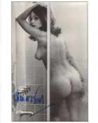 007 Bond girl Lana Wood signed photo, desirable image of her naked in the shower. Good condition.