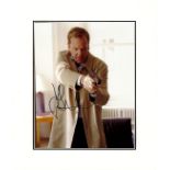 Kiefer Sutherland (24) signed photo. Mounted to approx. 13 x 11 inches frame. Good condition. Good