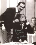 Fawlty Towers 8x10 comedy scene photo signed by actor Bernard Cribbins. Good condition. All