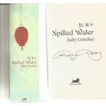 Sally Grindley signed hardback book titled Spilled Water. A clear signature from the author can be