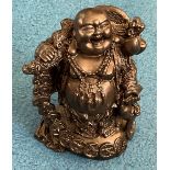 Black buddha carving. Approx 15cm in height. Good condition. We combine postage on multiple. Good