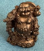 Black buddha carving. Approx 15cm in height. Good condition. We combine postage on multiple. Good