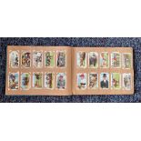 Cigarette card collection in album. Includes 48 stars of the screen coloured photographs 1936, 48