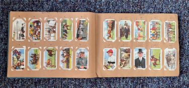 Cigarette card collection in album. Includes 48 stars of the screen coloured photographs 1936, 48