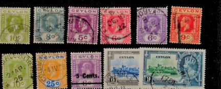 Ceylon 11 Stamps Pre 1936 GV On Stockcard. Good condition. We combine postage on multiple winning