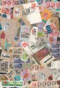 Assortment of world stamps on backing paper. Most quantity of GB stamps. Good condition. We. Good