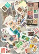 Collection Of Approximately 250 Worldwide Stamps On And Off Paper. Good condition. We combine
