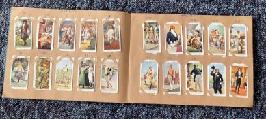 Cigarette card collection in album. Includes Dandies 1932, Butterflies 1932, Wildflowers 1939 and