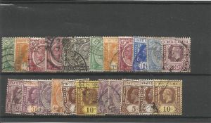Straits settlements 1921/1933 stamps on stockcard. 23 stamps. Good condition. We combine postage