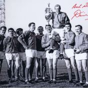 Autographed DENIS LAW 16 x 12 photo - B/W, depicting Manchester United players chairing captain