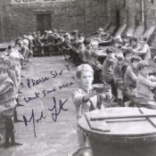 Oliver! 8x10 movie scene photo signed by Mark Lester who has added his line 'Please sir, I want some