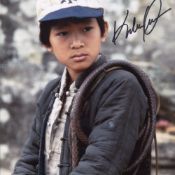 Indiana Jones and the Temple of Doom movie photo signed by child star Ke Huy Quan as short round.