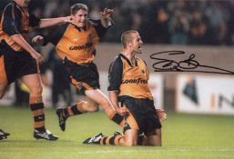 Autographed STEVE BULL 12 x 8 photo - Col, depicting the Wolves striker celebrating after scoring