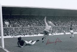 Autographed DENIS LAW 12 x 8 photo - B/W, depicting the Manchester United striker celebrating