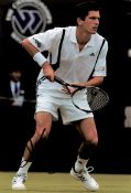 Tim Henman signed 12x8 colour photo. Timothy Henry Henman OBE (born 6 September 1974) is a British