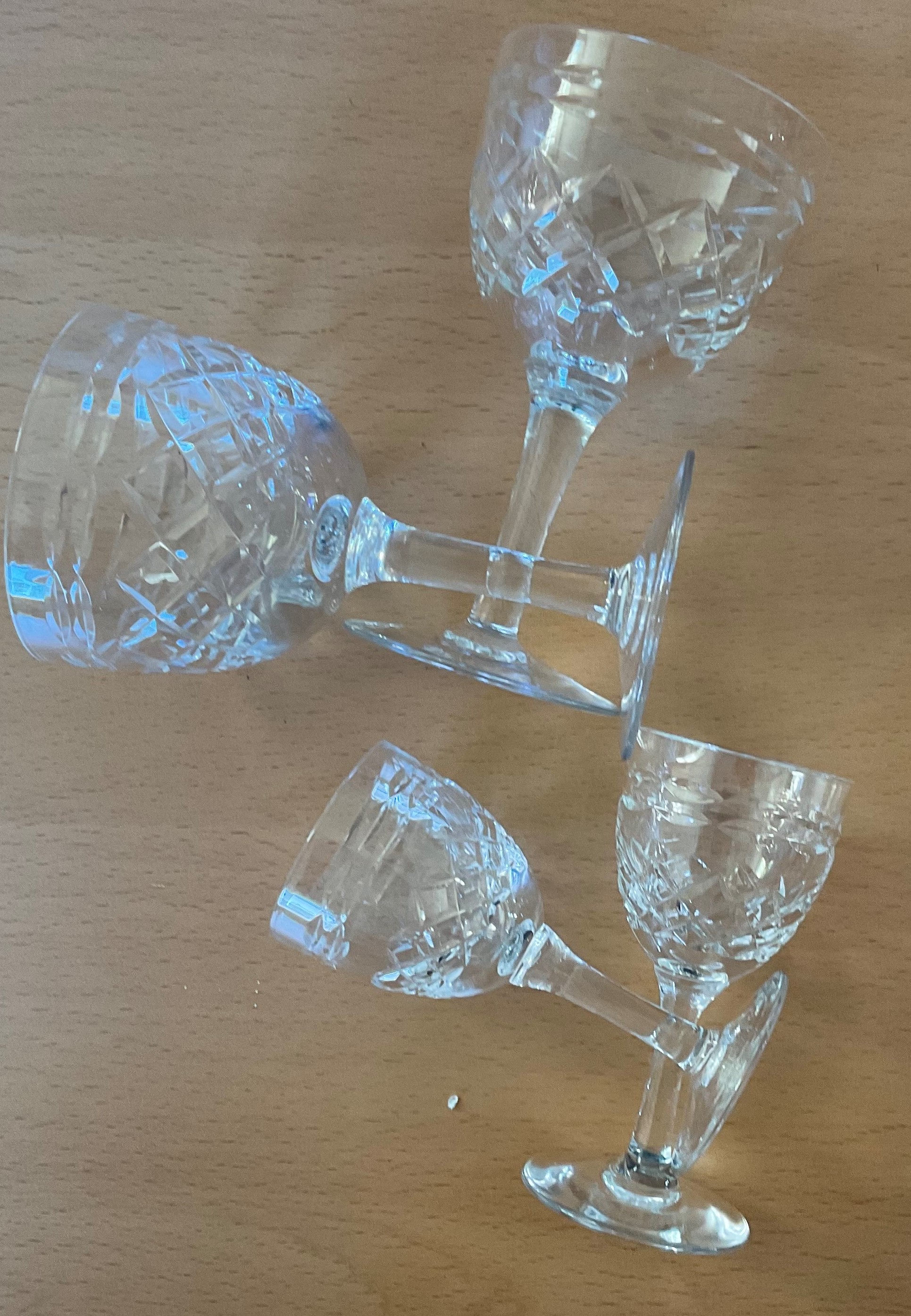 2 small clear vintage port glasses with patterns. 4 inches in height. No Chips or cracks. Good