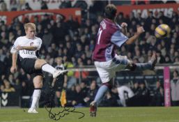 Autographed PAUL SCHOLES 12 x 8 photo - Col, depicting the Manchester United midfielder scoring a