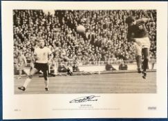 Geoff Hurst signed 23x17 black and white print pictured scoring the first goal of his hat trick