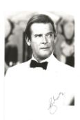 Sir Roger Moore in James Bond white tuxedo signed 3 1/2 x 5 1/2 black and white photo. Good