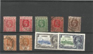 Nigeria pre 1935 stamps on stockcard. 9 stamps. Good condition. We combine postage on multiple