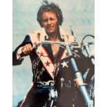 Evel Knievel 20x16 signed colour print pictured sitting on his motorcycle. Robert Craig Knievel (