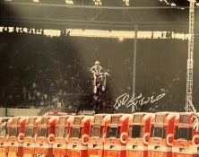 Evel Knievel 20x16 signed colour print pictured during his jump at Wembley Stadium in 1975. Robert