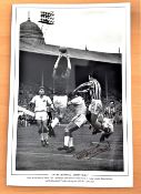 Football, Peter McParland signed 12x18 black and white photo. Pictured as he challenges Manchester