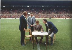 Football Bryan Robson signed 12x8 colour photo pictured signing for Manchester United. Bryan