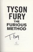 Tyson Fury signed hardback book titled the Furious Method. This lovely hardback book is in mint