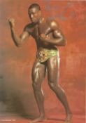 Boxing, Frank Bruno signed 12x8 colour photograph pictured wearing the WBC Heavyweight belt,