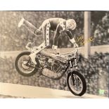 Evel Knievel signed 20x16 black and white photo picturing the legendary stuntman in action. Good