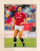 Paul McGrath signed 19x15 mounted colour photo pictured in action for Manchester United. Good