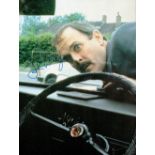 John Cleese, a signed 8x6 Clockwise film photo, with Cleese playing the part of headmaster Brian