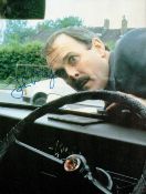 John Cleese, a signed 8x6 Clockwise film photo, with Cleese playing the part of headmaster Brian