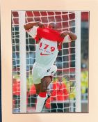 Ian Wright signed 19x15 mounted colour photo pictured during his playing days with Arsenal. Good