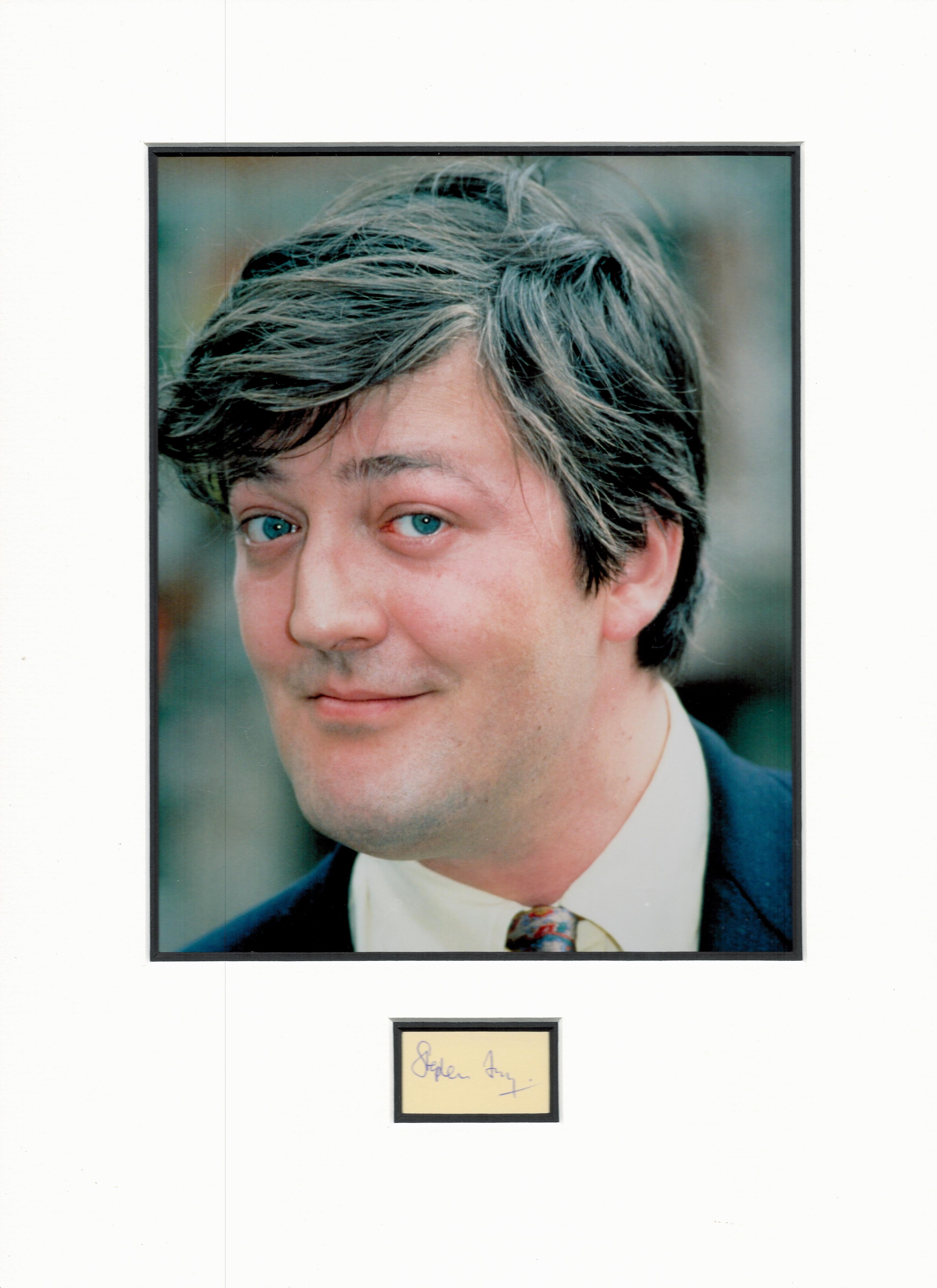 Stephen Fry small signature piece mounted below colour photo. Approx size 16x12. Good condition. All