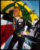 F1. Johnny Herbert Hand signed 10x8 Colour Photo. Photo shows Herbert in black racing suit