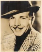 Dick Powell signed 10x8 sepia vintage photo dedicated with original Warner Bros mailing envelope