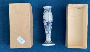 Tall blue and white vase with harbour scene painted. Stamped Delft on base. Good condition. We We