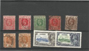 Nigeria pre 1935 stamps on stockcard. 9 stamps We combine postage on multiple winning lots and can