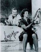 Sophia Loren signed 10x8 vintage black and white photo pictured with John Wayne.Good condition.